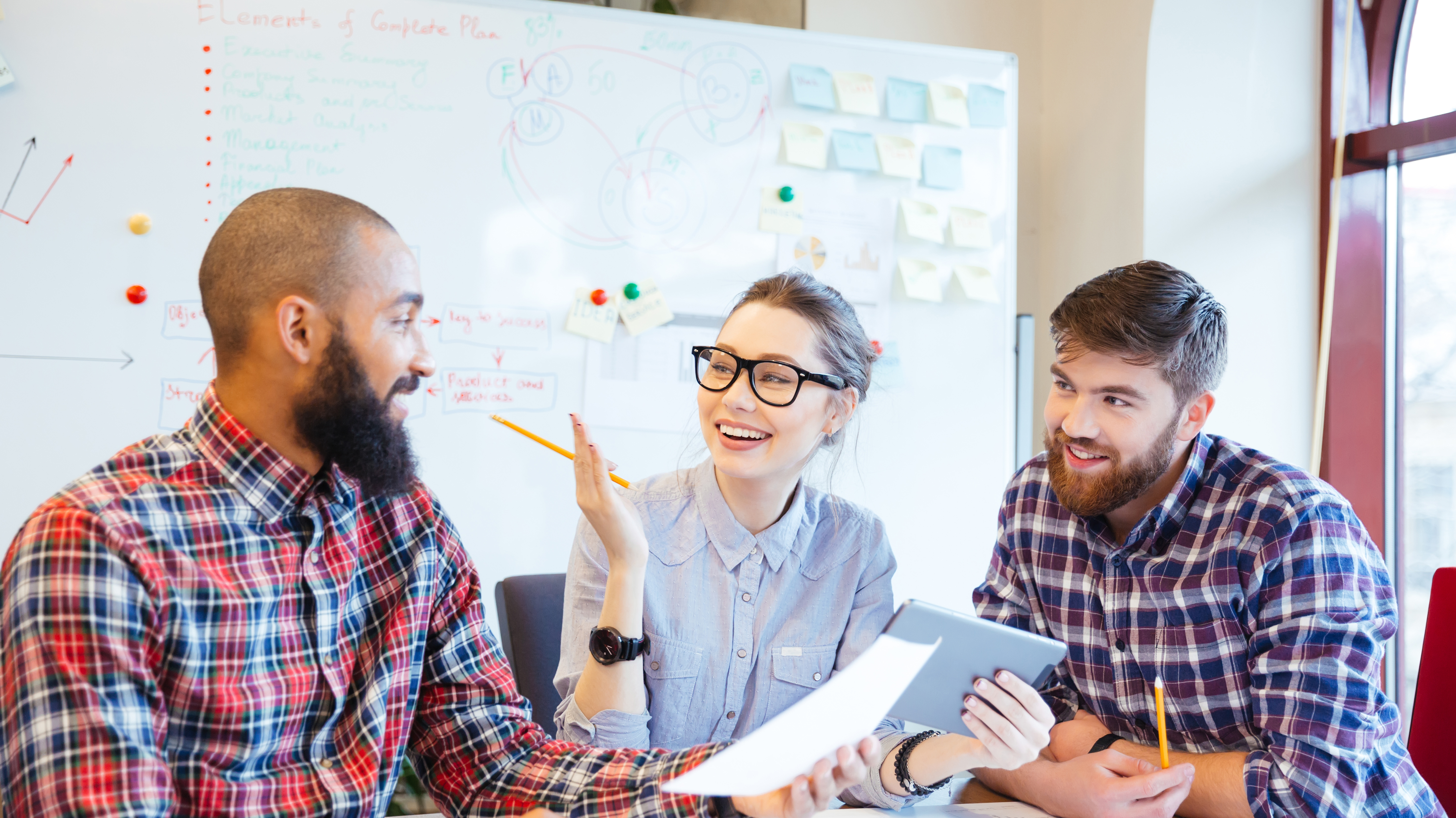 Multiethnic group of happy business people working together in office